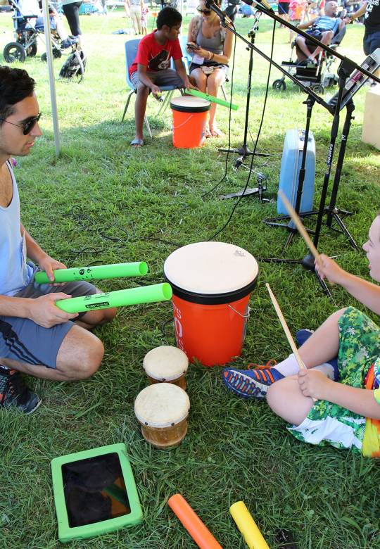 camper and counselor on drums